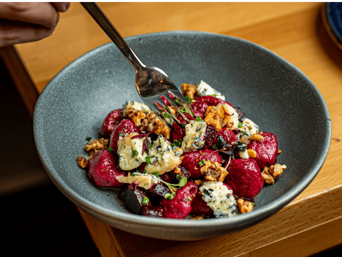 Purple carrot gnocchi with blue cheese and crunchy walnuts at Més de Vi
